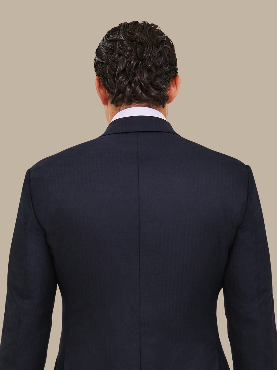 The Navy Herringbone Suit — garment photograph