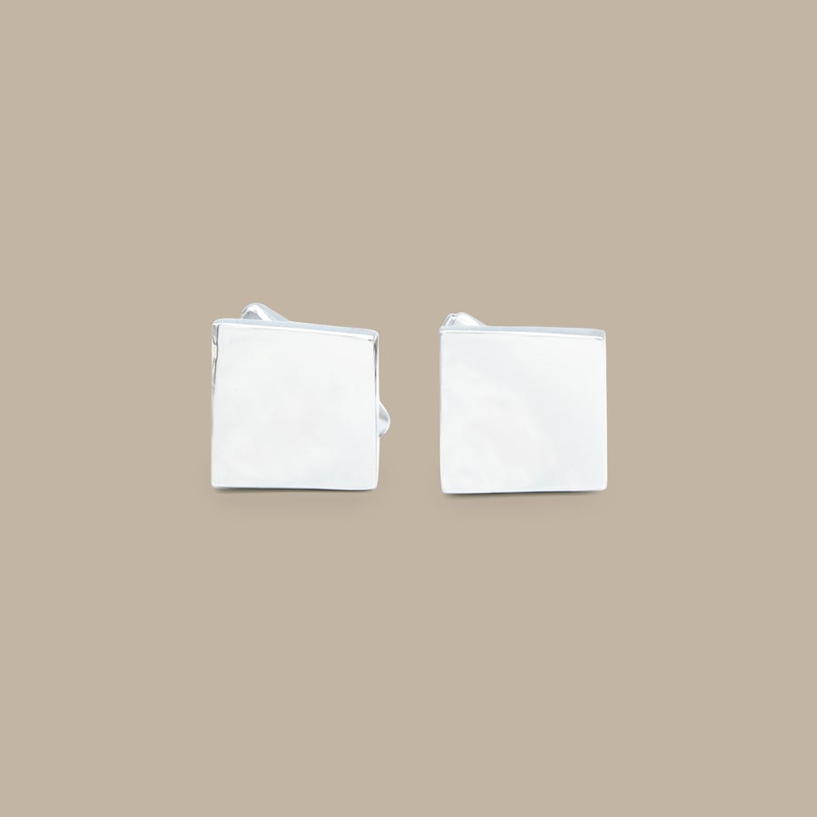 Curved Silver Diamond Cuff Links — garment photograph