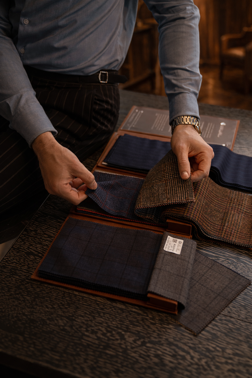 Premium fabric swatches from Loro Piana, Zegna, and Dormeuil